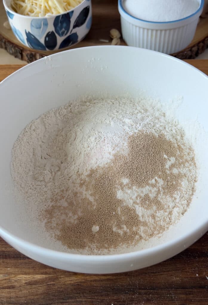 bowl with flour salt yeast and sugar