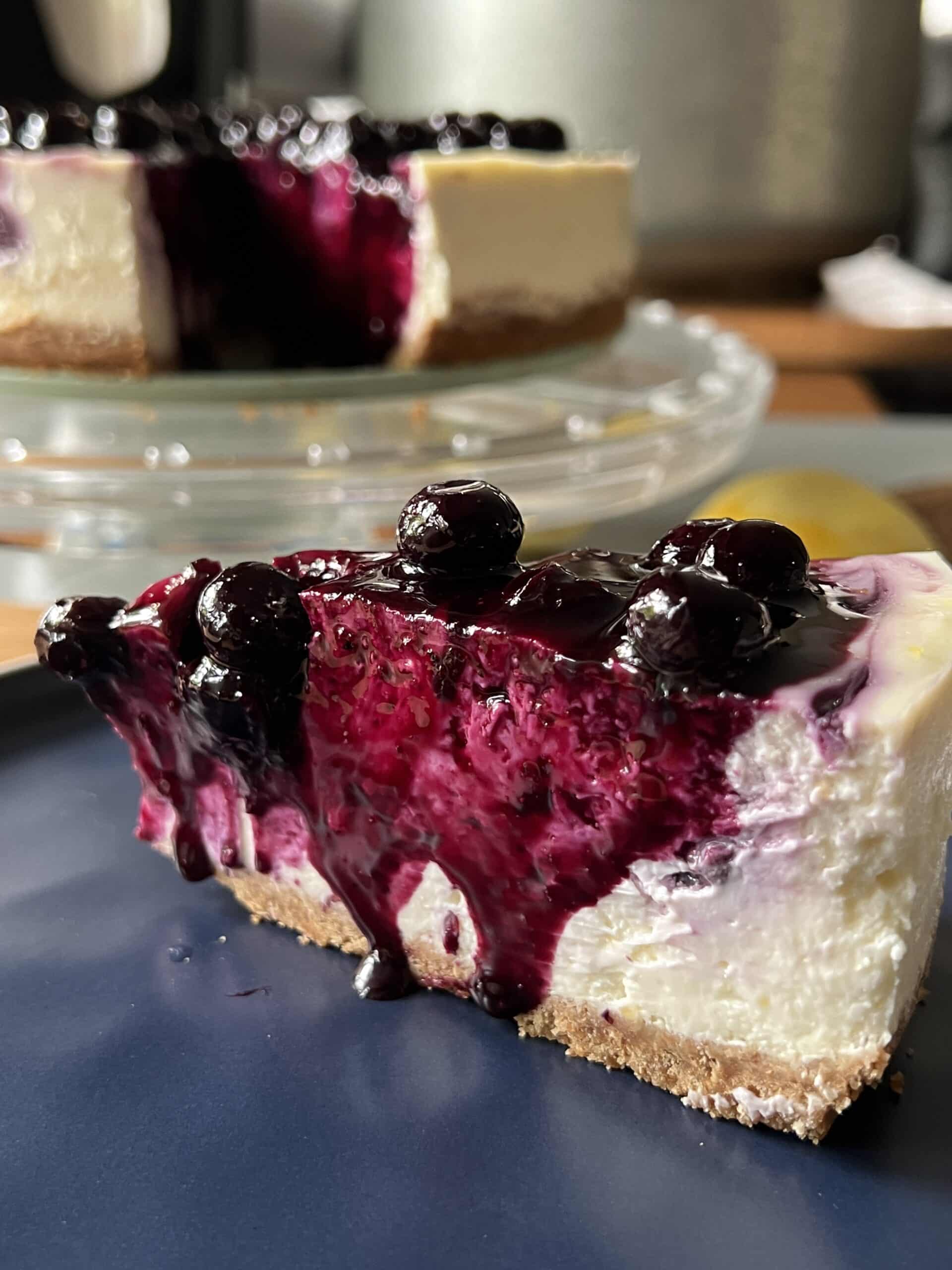 blueberry lemon cheesecake slice on a plate