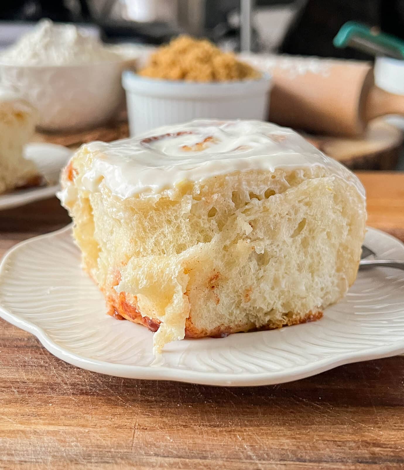 fluffy and soft cinnamon roll on a white plate