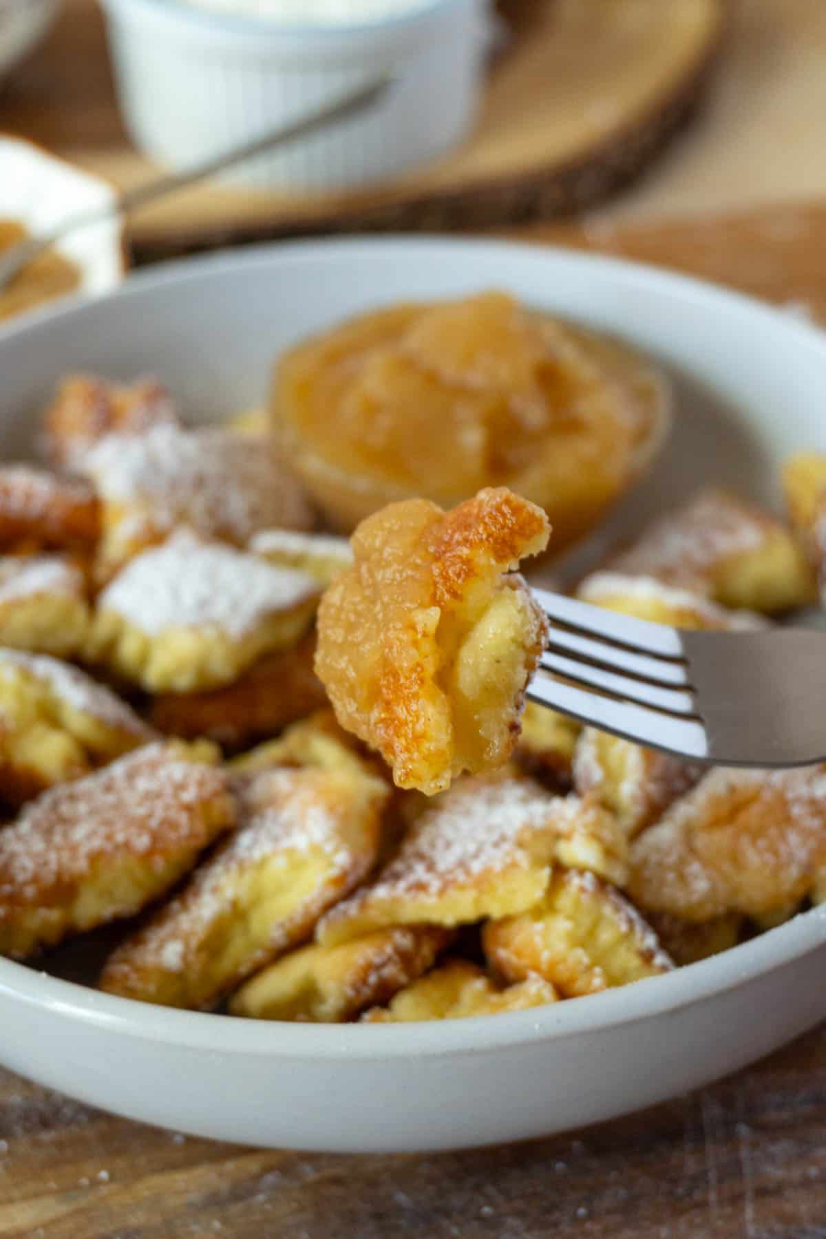 shredded pancakes on a plate - kaiserschmarnn