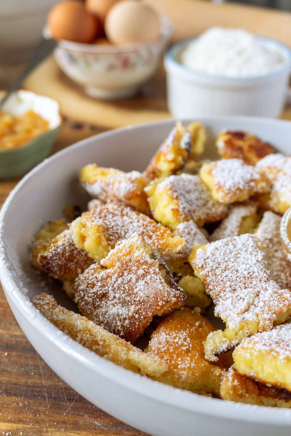 shredded pancakes dusted with powdered sugar on a plate