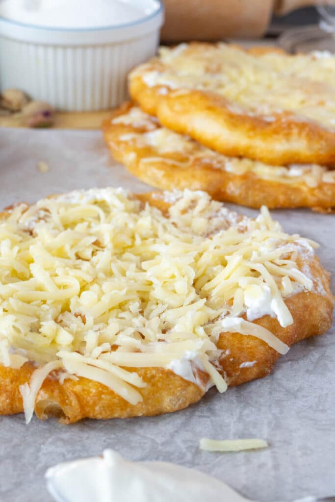 langos (hungarian fried flatbread) with cheese