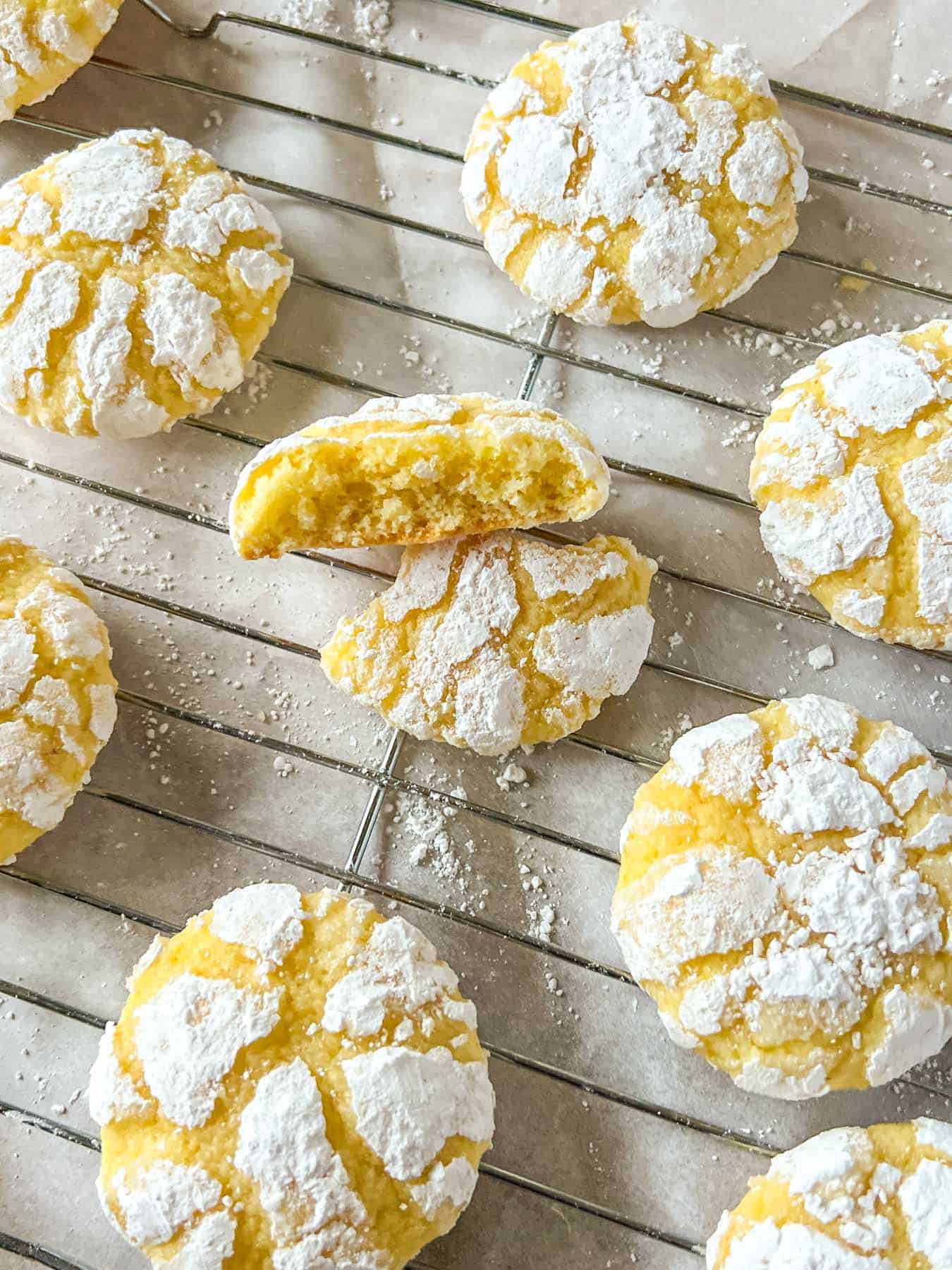 yellow lemon crinkle cookies on a rack