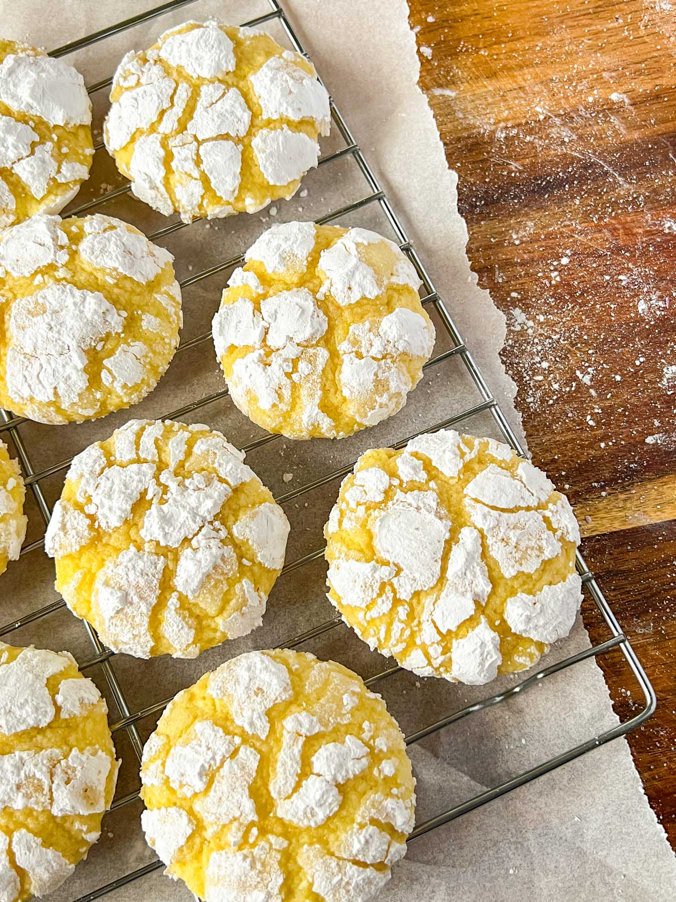 yellow lemon crinkle cookies on a rack