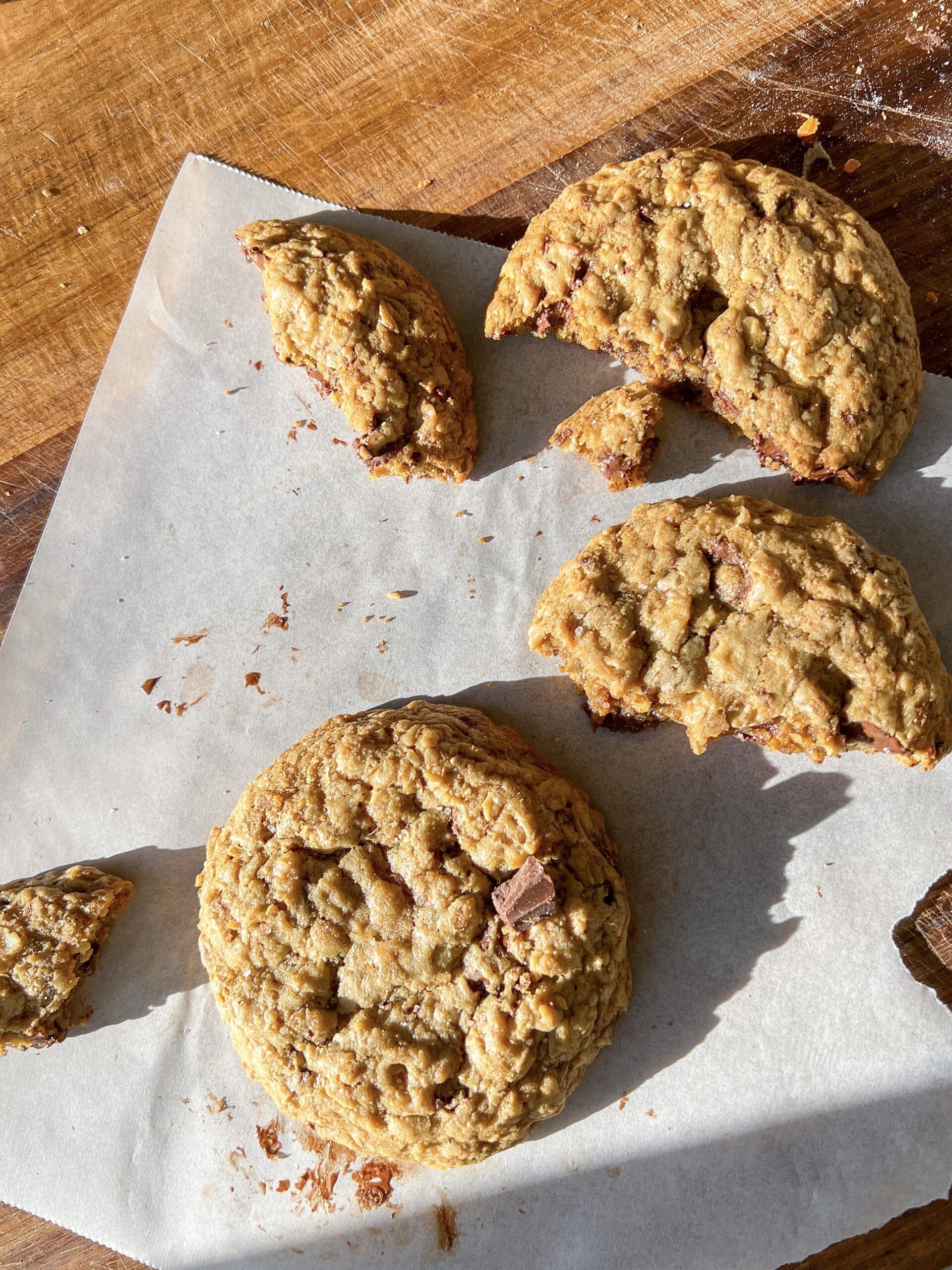 Oatmeal chocolate chip cookies with a few broken pieces