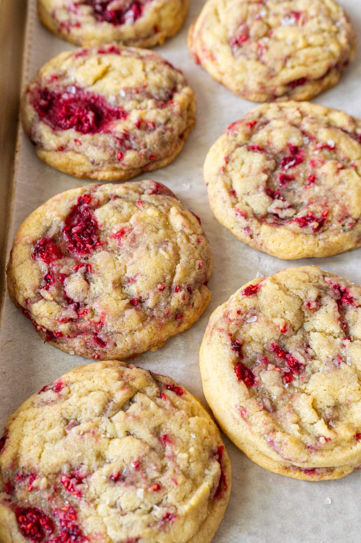 7 vanilla raspberry cookies on a pan