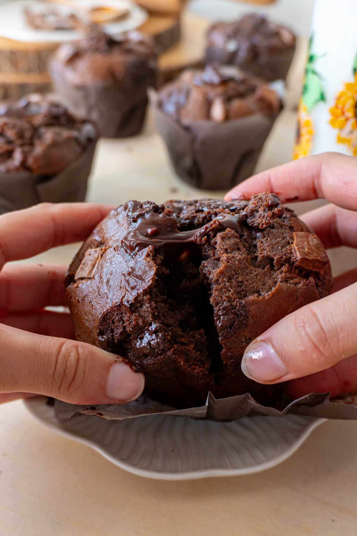 Olympic Double Chocolate Muffin being broken in half