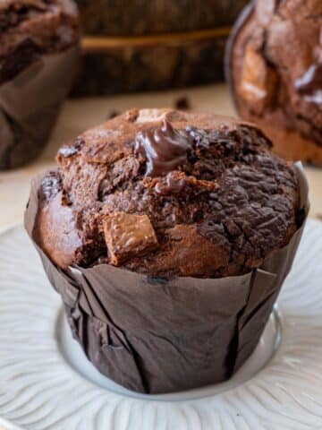 Olympic Double Chocolate Muffin on a white plate