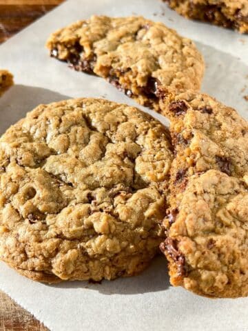 Oatmeal chocolate chip cookies with a few broken pieces