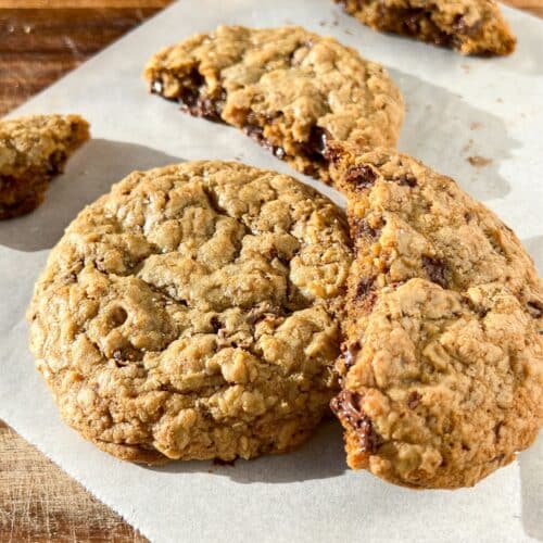 Oatmeal chocolate chip cookies with a few broken pieces