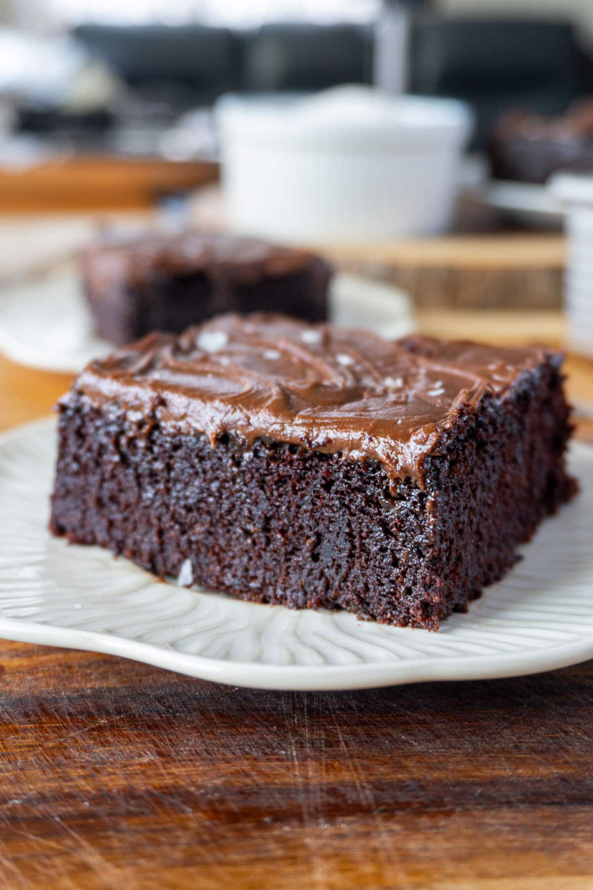 a slice of chocolate cake in a white plate 