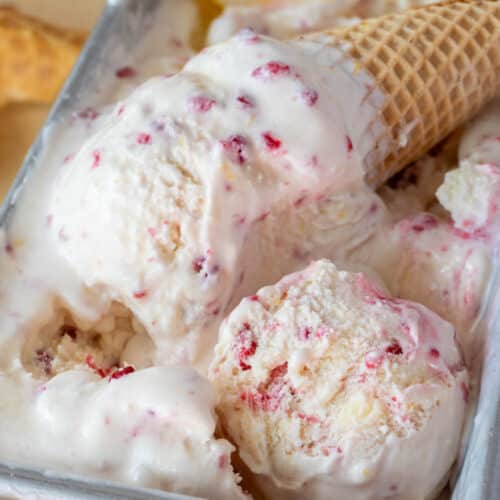 ice cream in a cone, with a scoop in the container