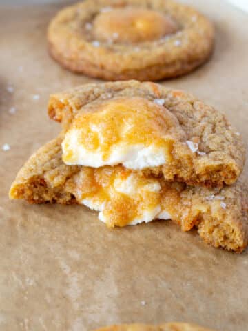 a stuffed carrot cake cookie in half, stacked