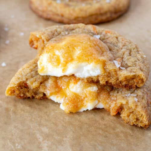 a stuffed carrot cake cookie in half, stacked