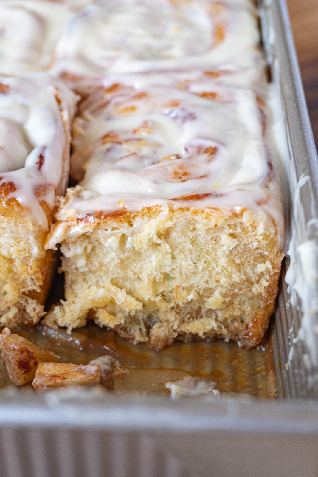 cinnamon rolls in a pan, a side angle