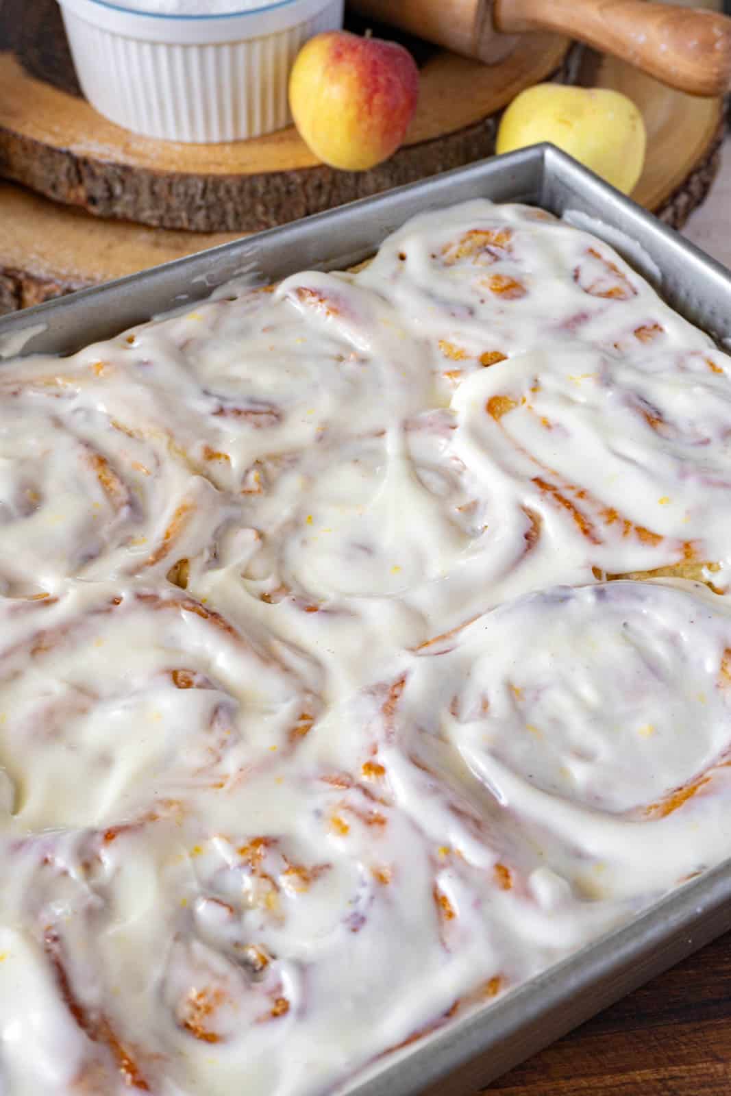 cinnamon rolls with frosting, in a pan