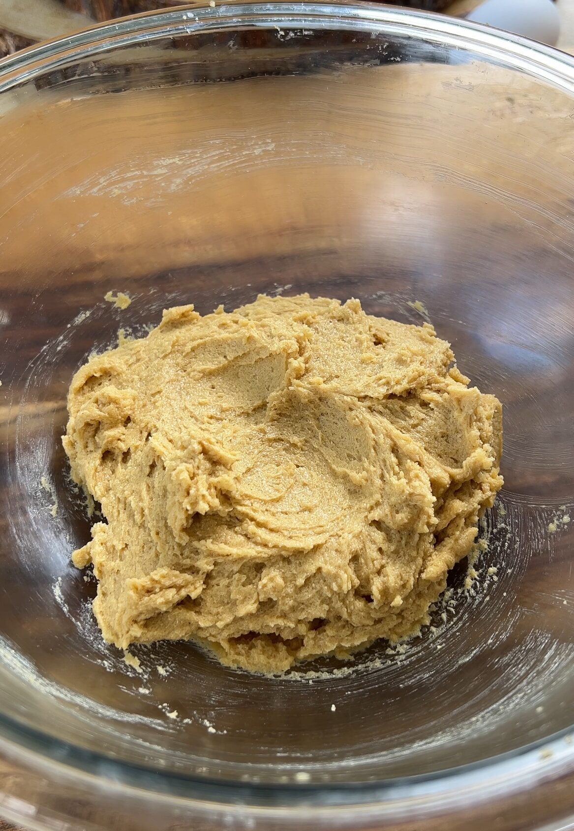 Cookie batter- butter, sugar, and eggs in a glass bowl