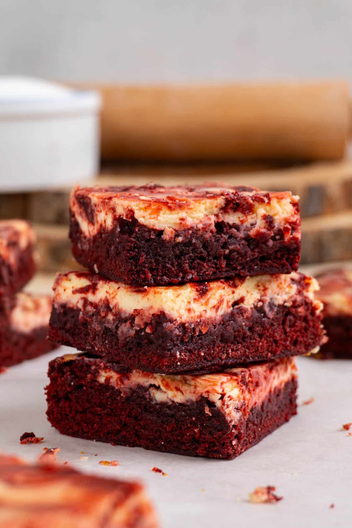 3 red velvet cheesecake brownies stacked 