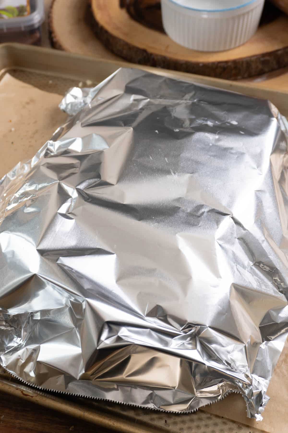 foil covering butter chicken rolls