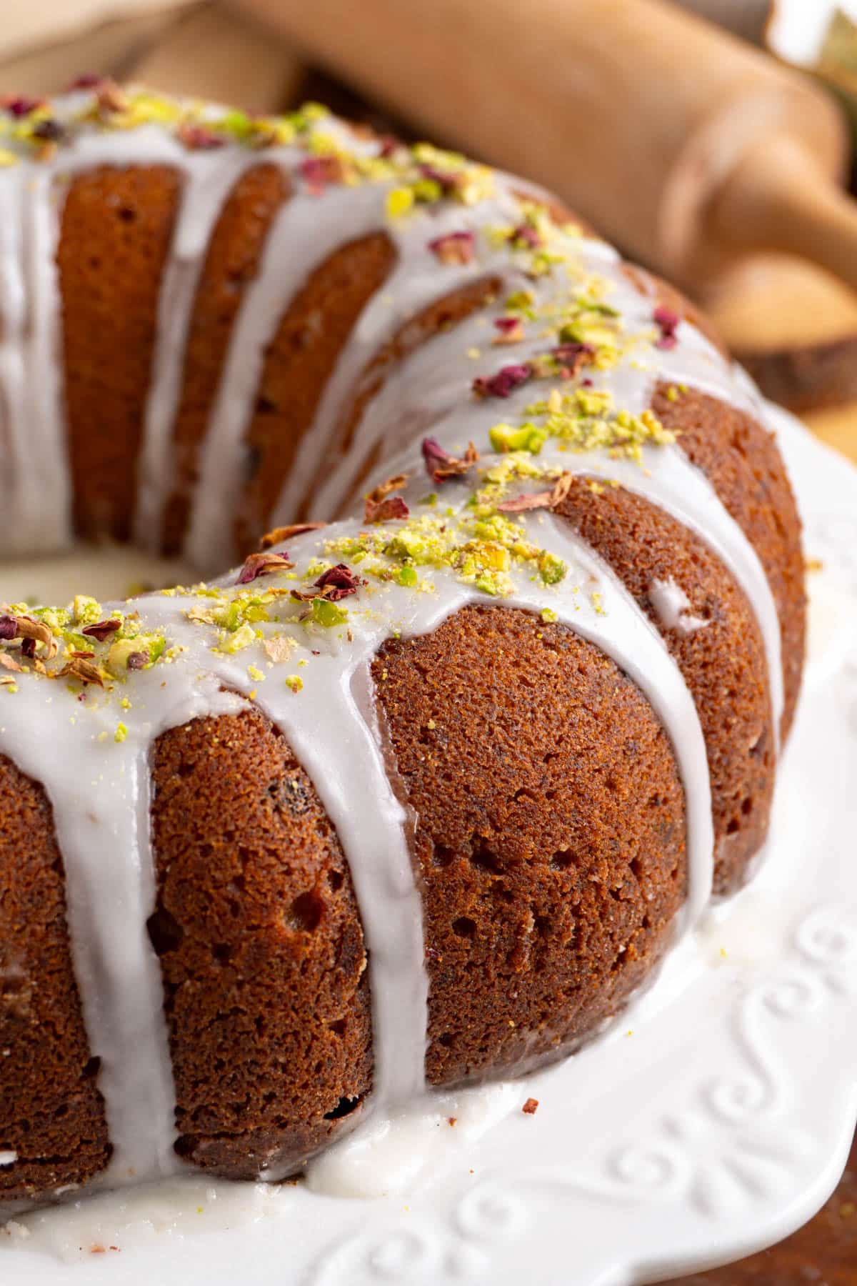 gulab jamun date cake on a white platter