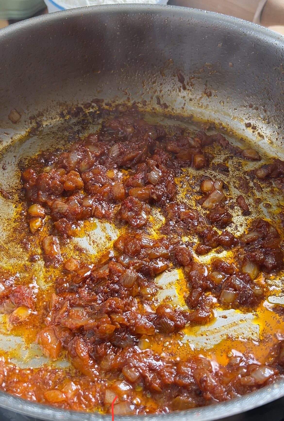 Tomato paste cooked down in a pan