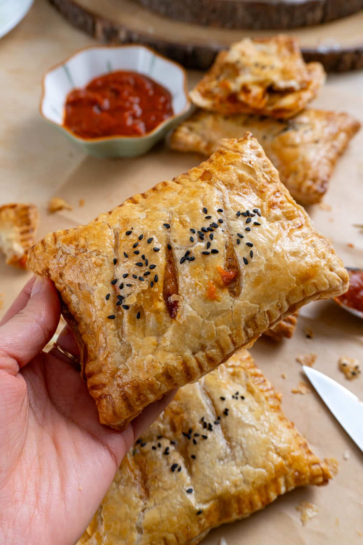 a pizza pocket held in a hand