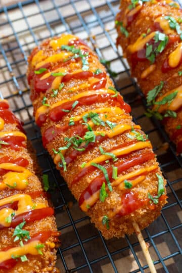 3 korean corn dogs on a wire rack